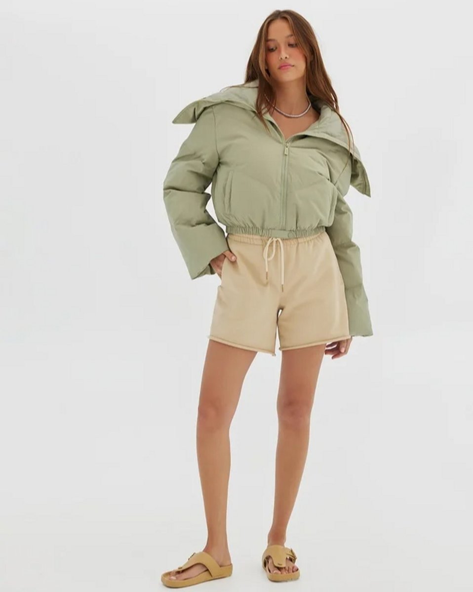 woman wearing sage cropped puffer jacket 