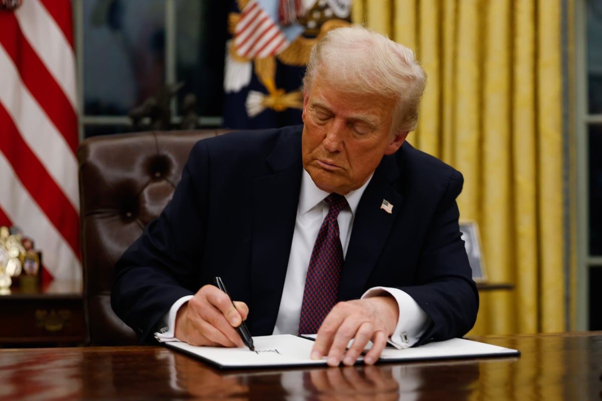 Donald Trump signing executive orders after his inauguration.