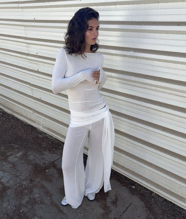 woman wearing mesh white tie pants