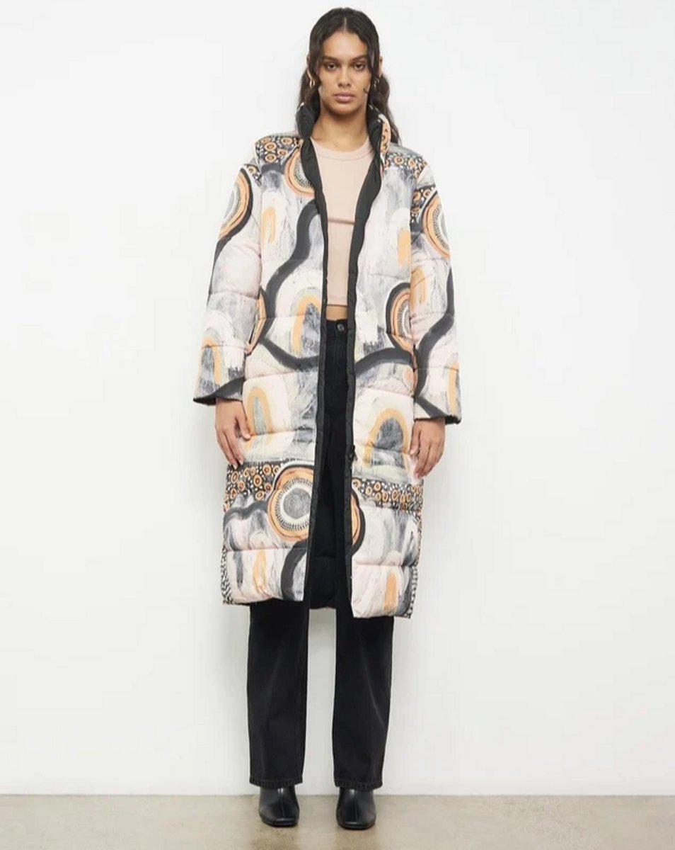 womanwearing patterned puffer jacket 