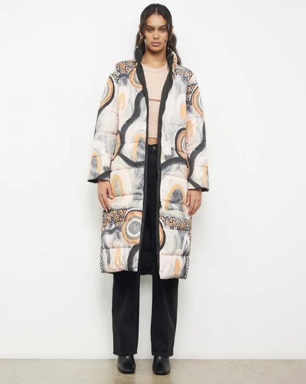 womanwearing patterned puffer jacket