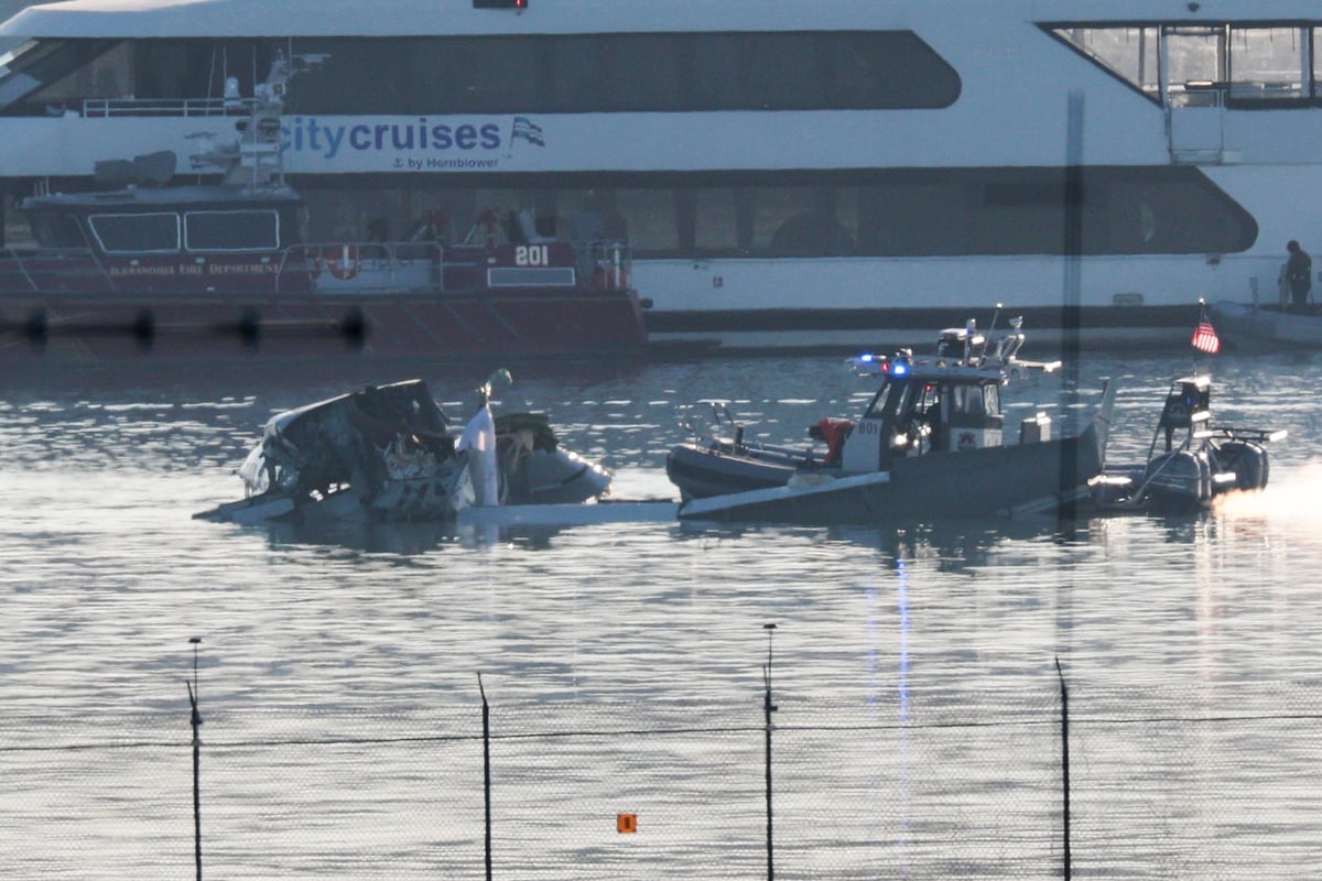 Emergency response units search the crash site of the American Airlines plane on the Potomac River after the plane crashed on approach to Reagan National Airport on January 30, 2025.