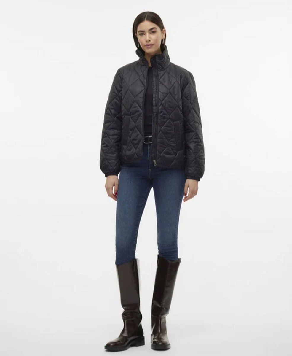 woman wearing black puffer vest 
