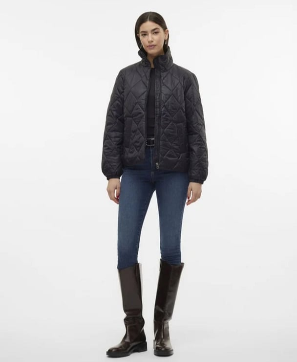 woman wearing black puffer vest