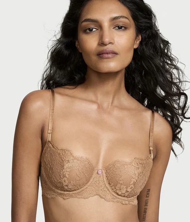 woman wearing nude lace bra from Victoria's Secret