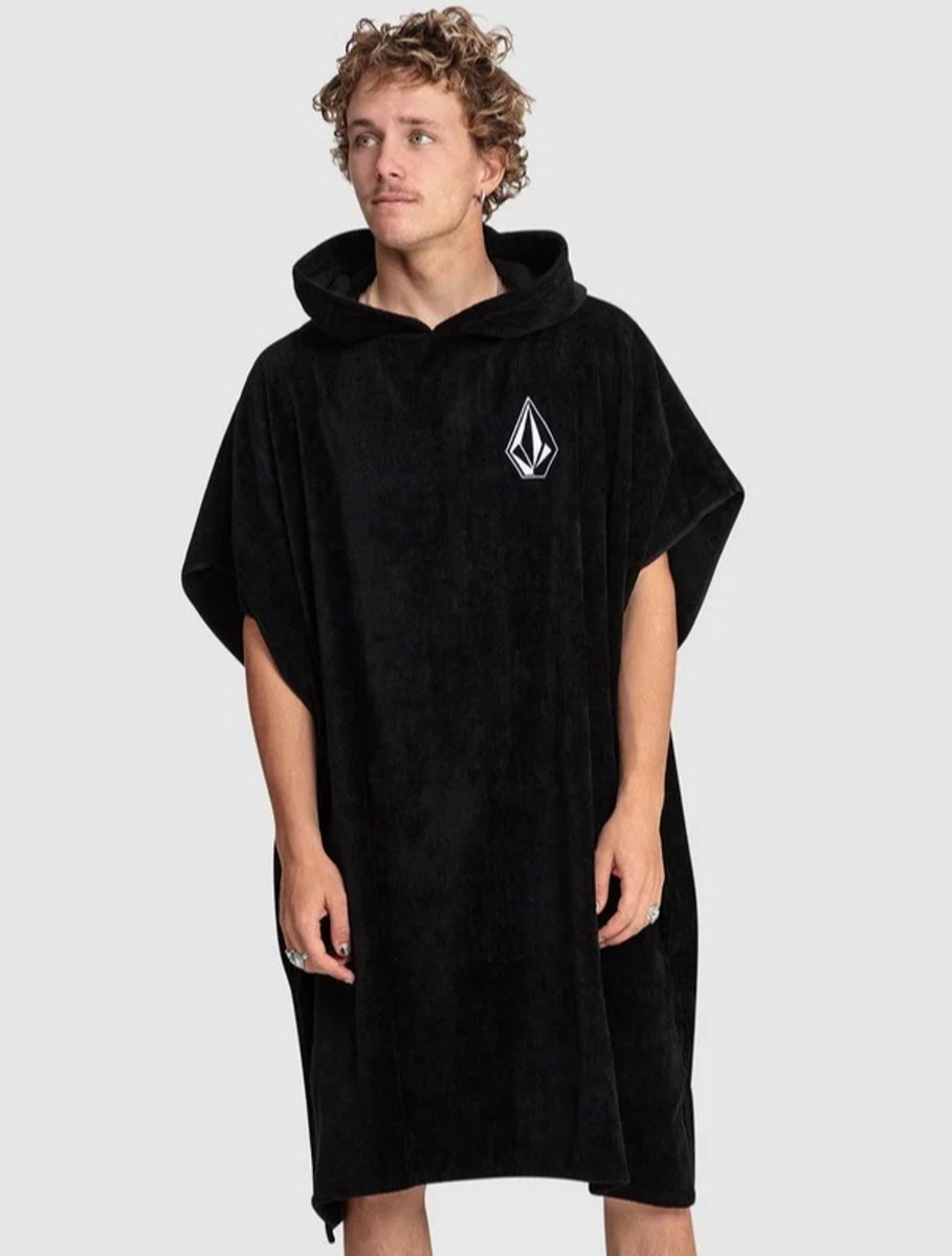 teenager wearing black beach Volcom robe 