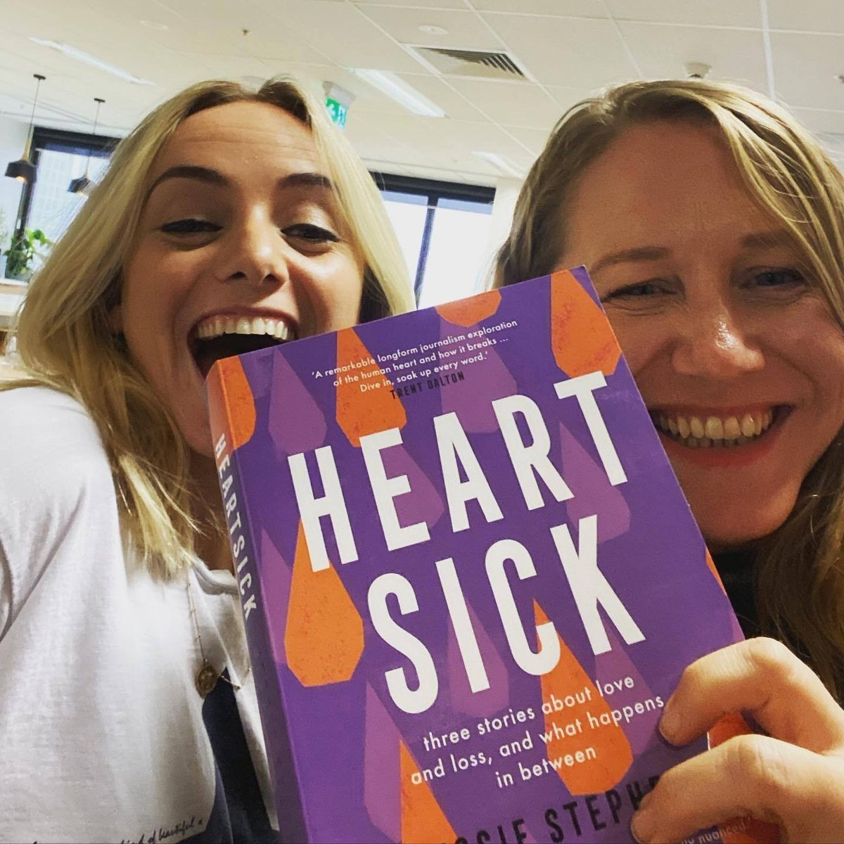 Holly Wainwright and Jessie Stephens with her book 'Heartsick'. 