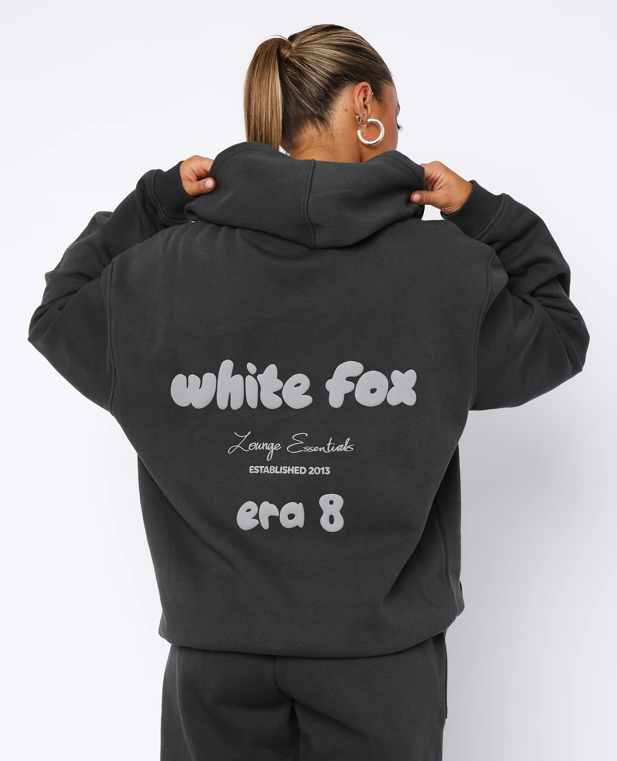 woman wearing white fox hoodie 