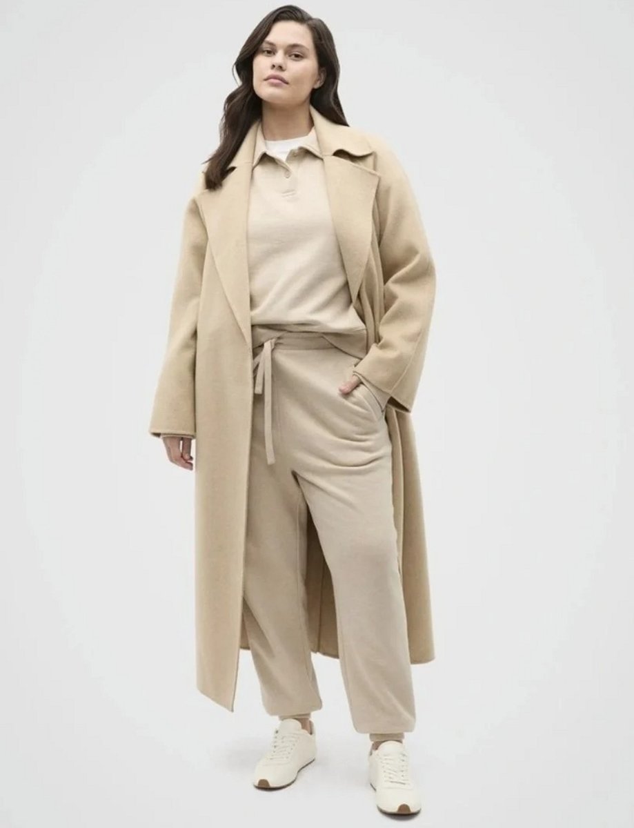 woman wearing mathcing winter tracksuit in a coat.